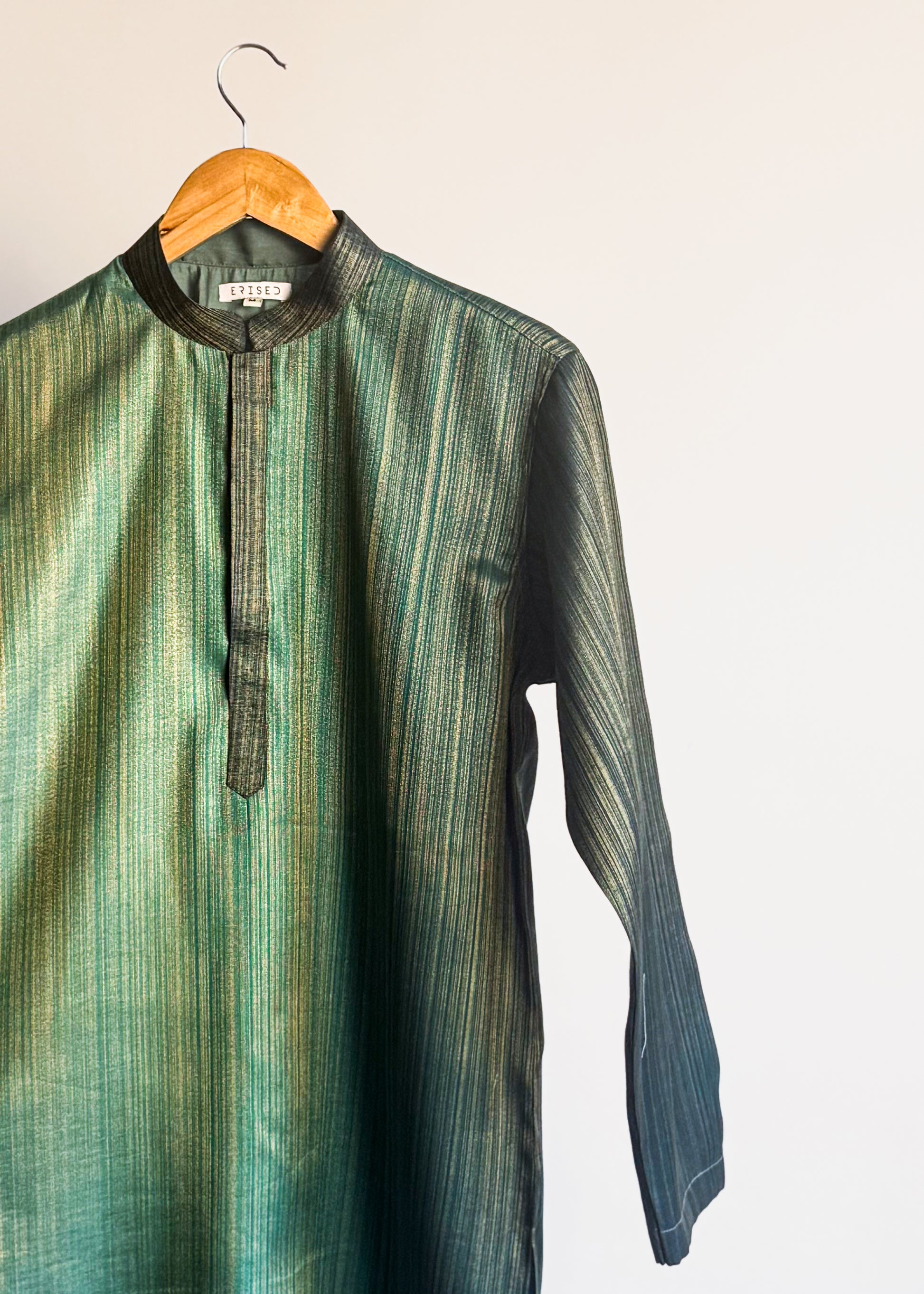 Teal green plain kurta with shade-work ombré and continuous gold zari lines