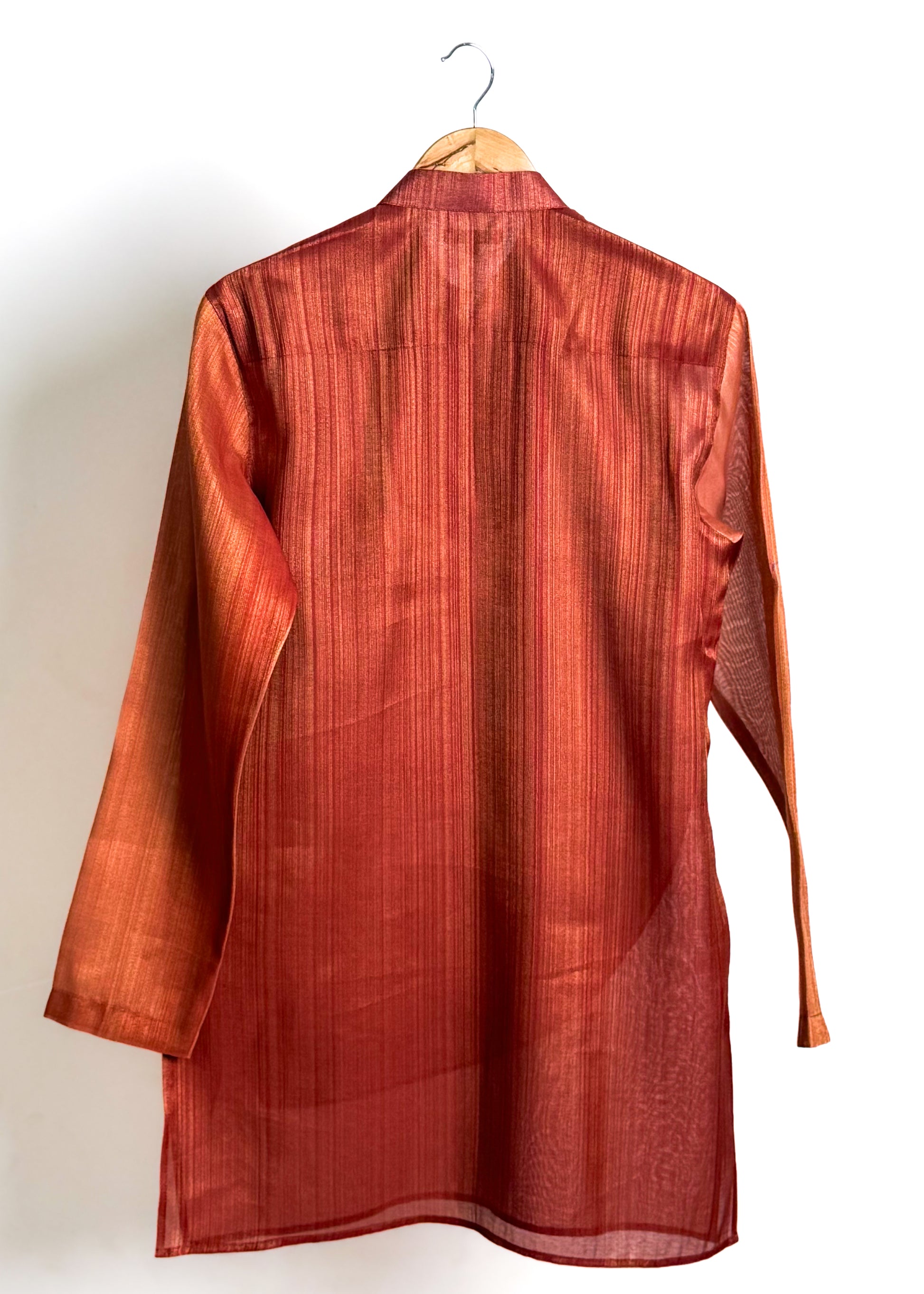 Rust drape kurta with fluid cowl, shade-work ombré and continuous gold zari lines
