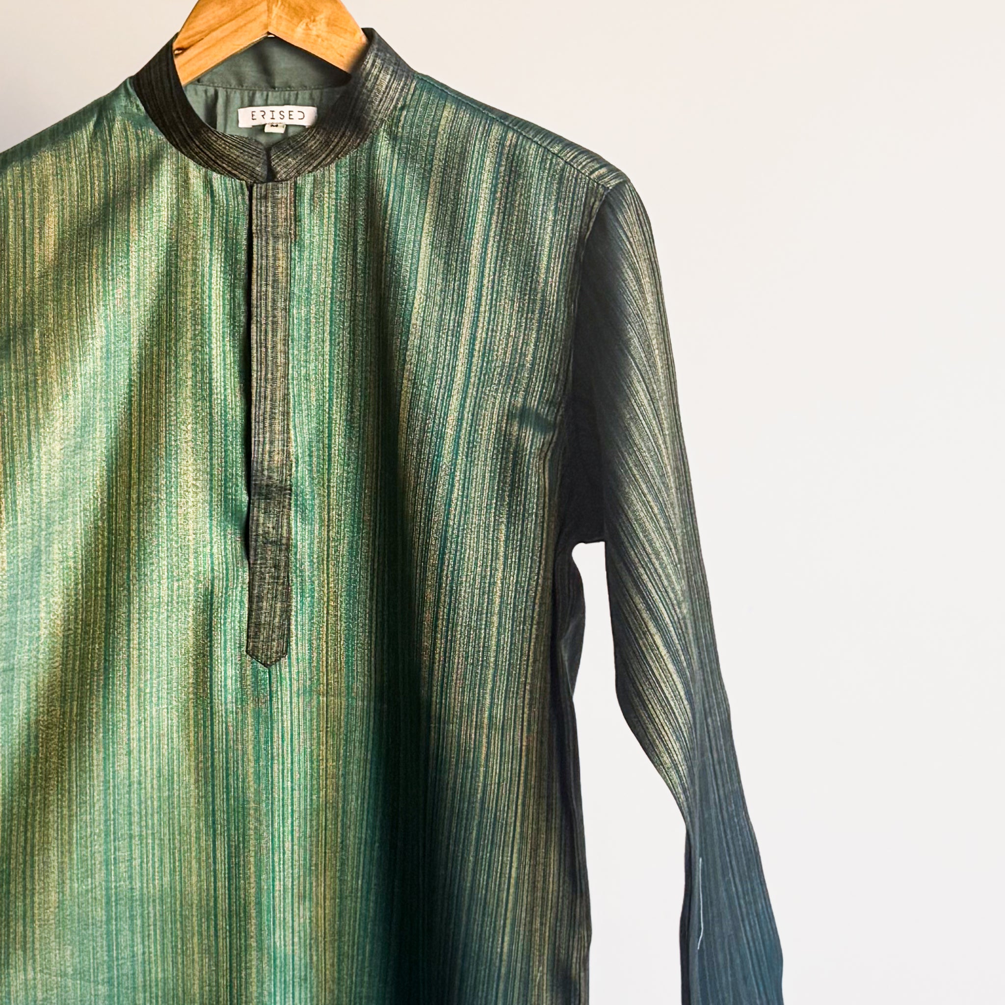 Teal green plain kurta with shade-work ombré and continuous gold zari lines