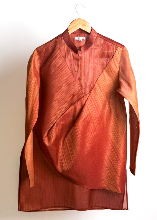 Rust drape kurta with fluid cowl, shade-work ombré and continuous gold zari lines
