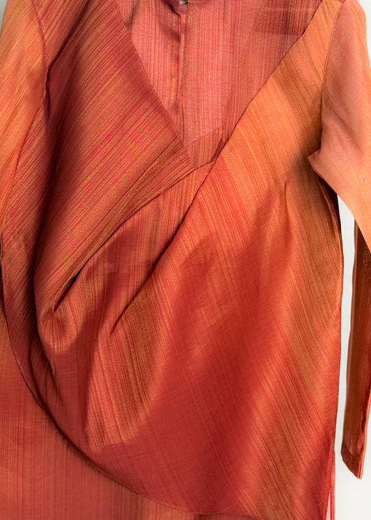 Rust drape kurta with fluid cowl, shade-work ombré and continuous gold zari lines