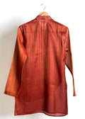 Rust drape kurta with fluid cowl, shade-work ombré and continuous gold zari lines
